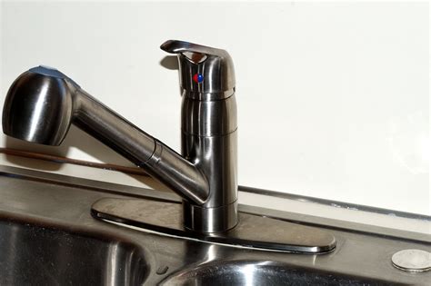 To remove a Moen kitchen faucet, detach the index plate on the handle of the faucet and remove the screw that is exposed to take out the handle. Next, take out the bonnet nut that ...